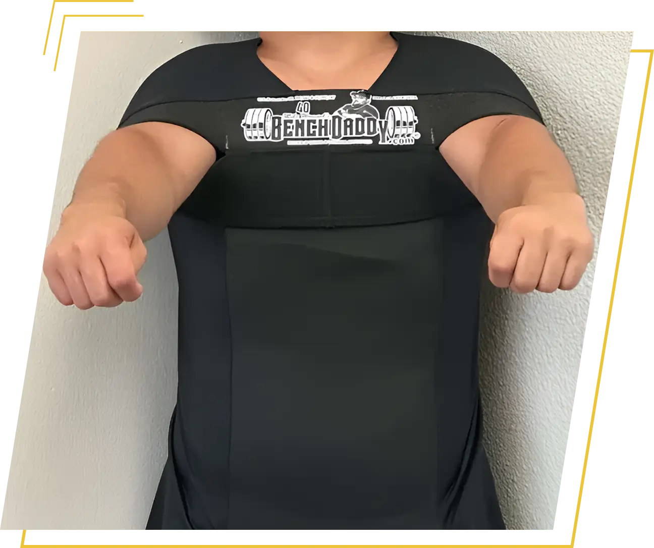 Person wearing black bench press shirt.